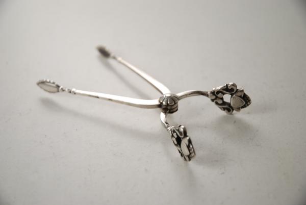 A Pair of Georg Jensen Silver Sugar Tongs: Acorn Pattern