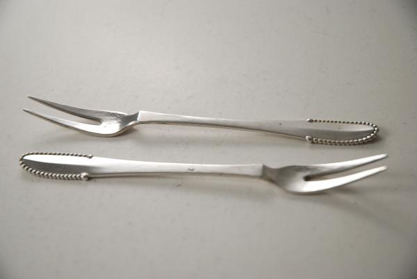 A Pair of Georg Jensen Bead Pattern Silver Pickle Forks