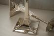 A Pair of Arts and Crafts Silver Candlesticks by James Dixon and Sons